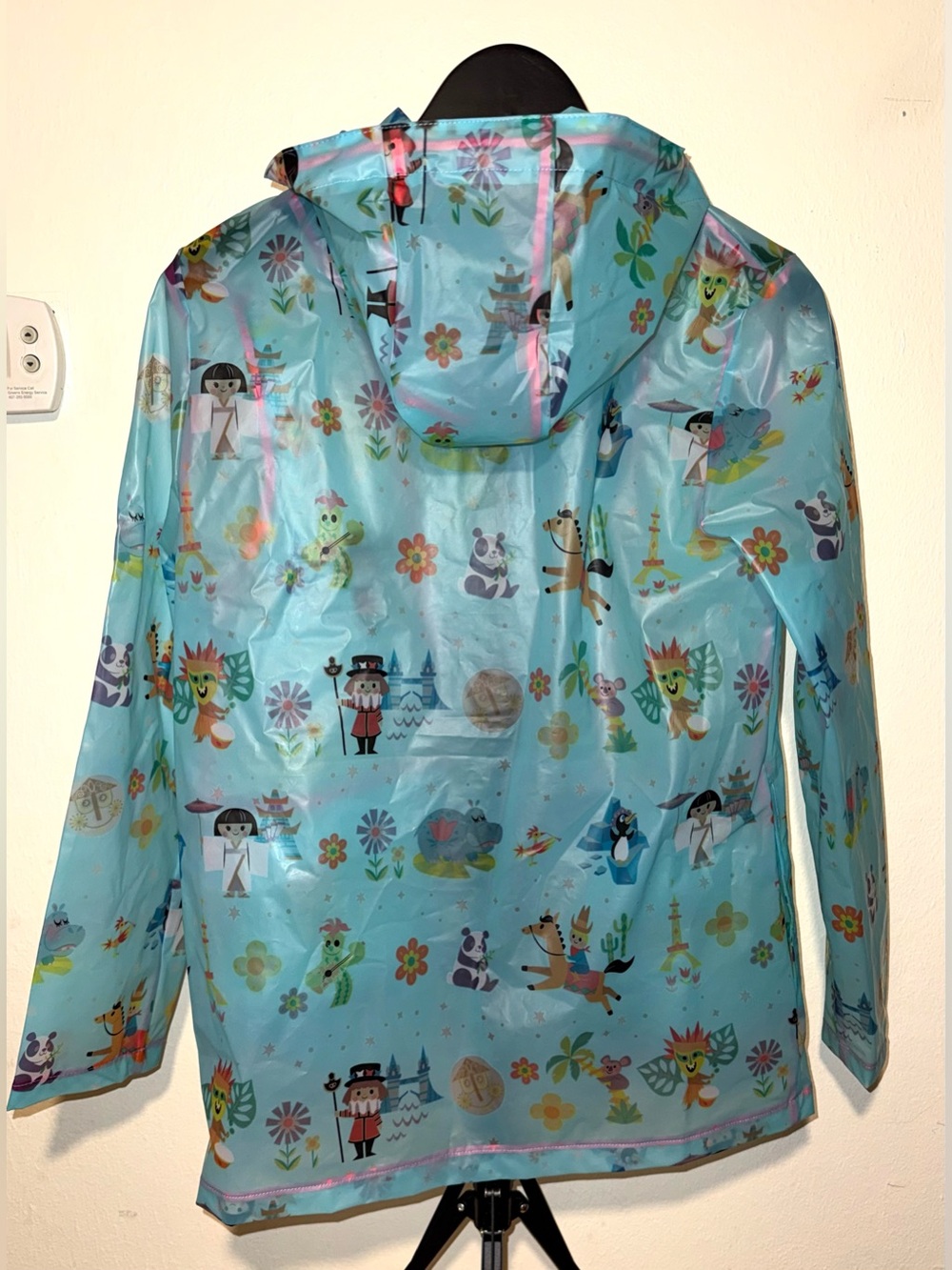 Disney Parks translucent blue “It’s a Small World” Raincoat, size S, EUC - Picture 3 of 6